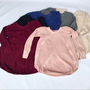 Long sleeve billowing cable knit sweater.